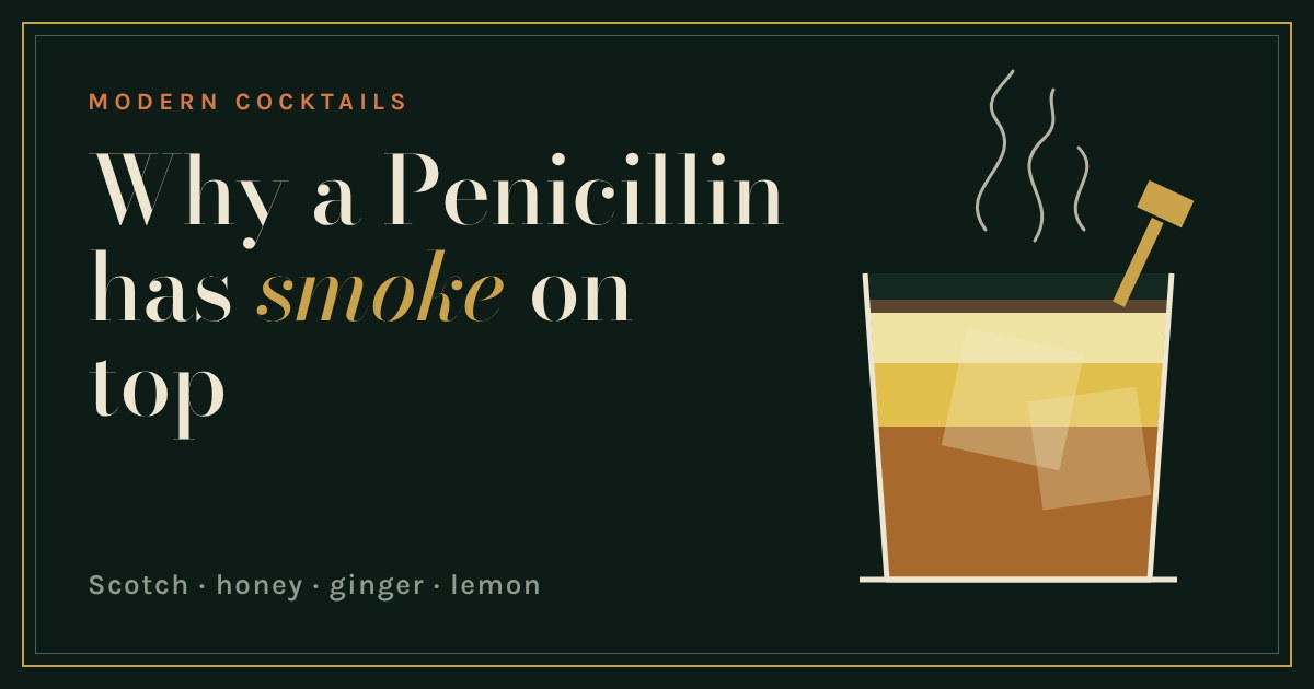 A rocks glass of layered amber, honey and lemon drink with a gold ginger pick and wisps of smoke above
